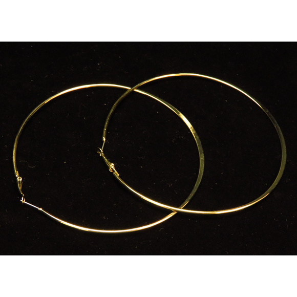 bebe Jewelry - bebe large gold hoop earring NWOT bbe41nc